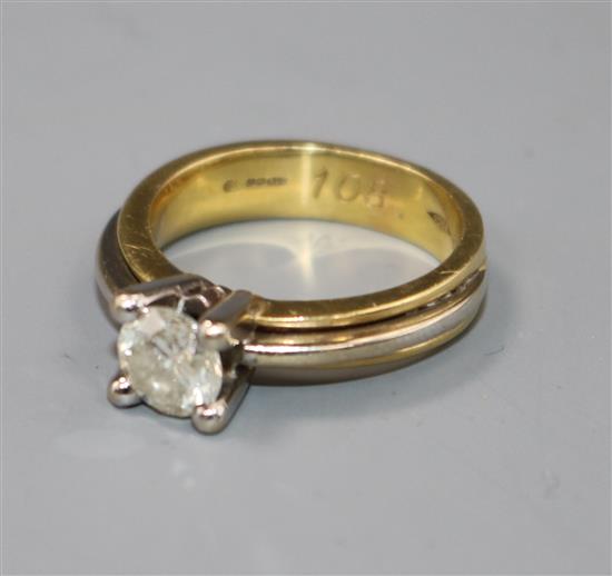 A diamond solitaire ring, 18ct yellow and white gold shank, size N.